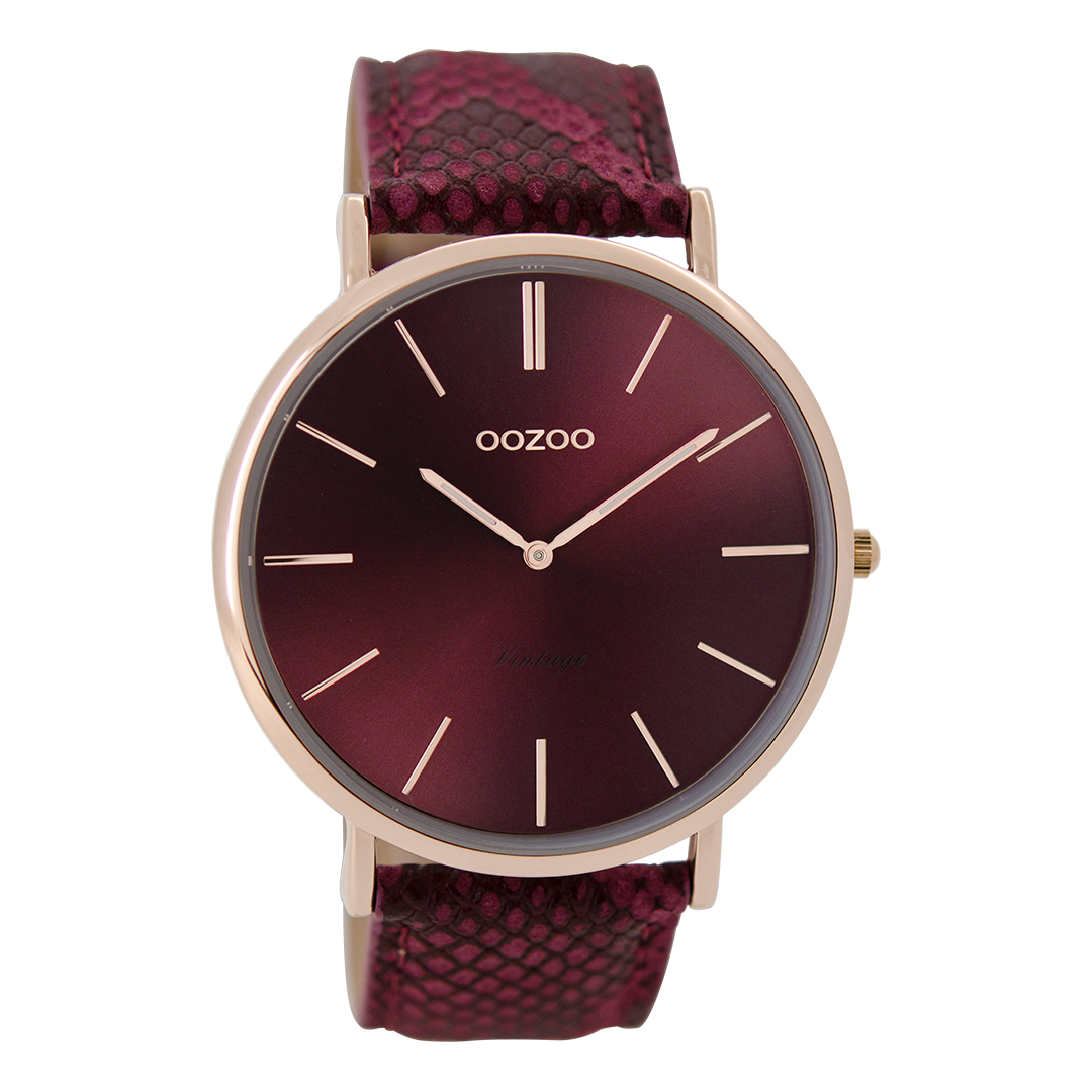 Rose gold coloured watch with burgundy leather strap